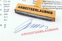 Stamp work permit. Picture: Bounlow-pic/Fotolia.com