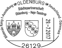 Städtepartnerschaft Poststempel. Quelle: Briefmarkenfreunde Oldenburg e. V. Sonderpoststempel mit dem Text „Bilaterale Rand-1-Ausstellung Oldenburg – Deutschland-Dänemark; Städtepartnerschaft Oldenburg – Hoje-Taastrup“ sowie den Wappen beider Städte. Quelle: Briefmarkenfreunde Oldenburg e. V.