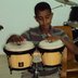 Vorschau: Ein Junge mit Bongos, zwei kleinen Trommeln. Foto: Edna Taff