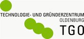 Logo Technologie- und Gründerzentrum Oldenburg (TGO). Schwarze Schrift, vier grüne Punkte von unten Mitte nach oben links als Reihe verlaufend. Quelle: TGO