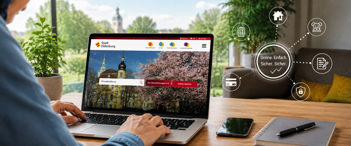 Person am Schreibtisch blickt über die Schulter auf einen Laptop, der das Serviceportal der Stadt Oldenburg mit rotem Header und Suchleiste zeigt; im Hintergrund Fenster, Bäume