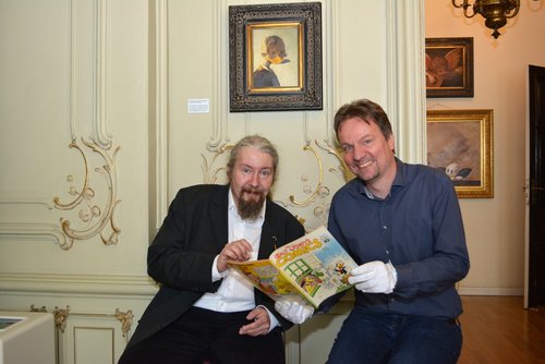 Dirk Meyer und Andreas von Seggern lesen Comics, Foto: Stadtmuseum